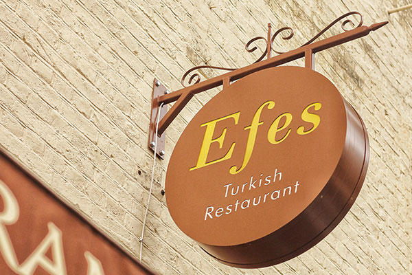 Efes Hanging Signs for Storefront by Igna Signs & Graphics